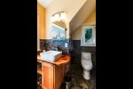 Glass and Stone primary bathroom